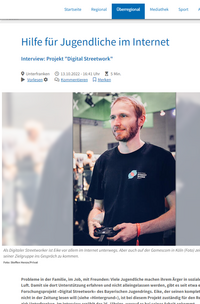 Ein Screenshot eines Artikels des Mediums: Main-Echo. Zu sehe ist ein junger Mensch, der mit einem Controller ein Videospiel spielt.