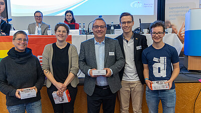 Vier Referent:innen zum Schwerpunktthema mit Kommissionsvorsitzenden Malte Scholz (2. von rechts)